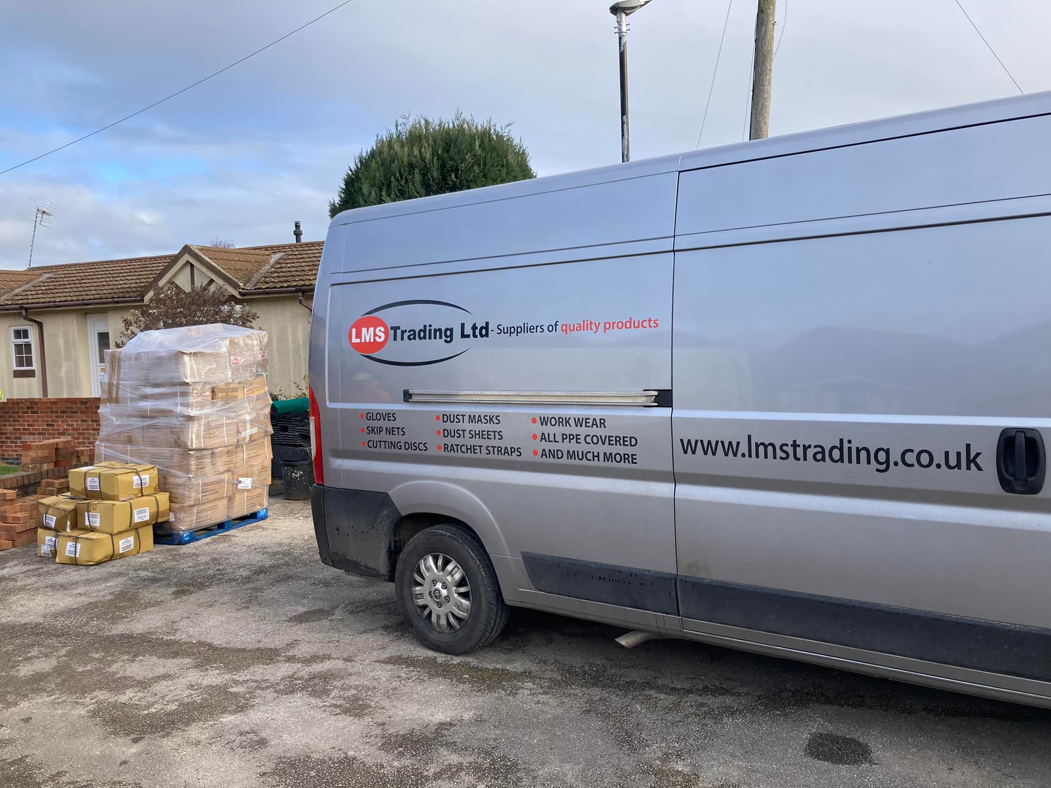 LMS Trading branded delivery van beside site supplies